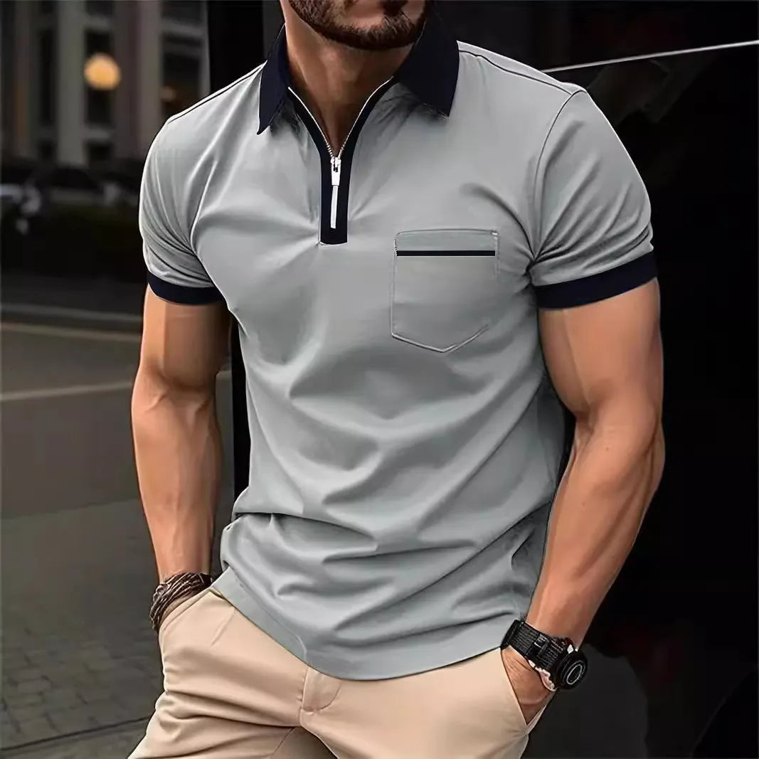 Man wearing a loose-fit men's short sleeve casual shirt with a chest pocket and zipper decoration.