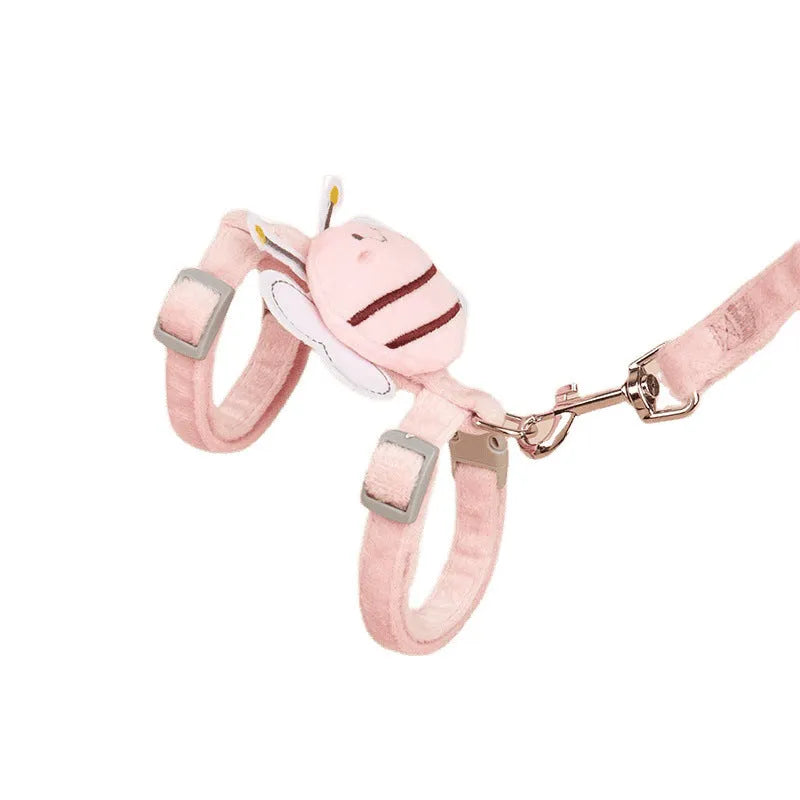Pink teddy bee-shaped adjustable cat leash and rope on a blue background.