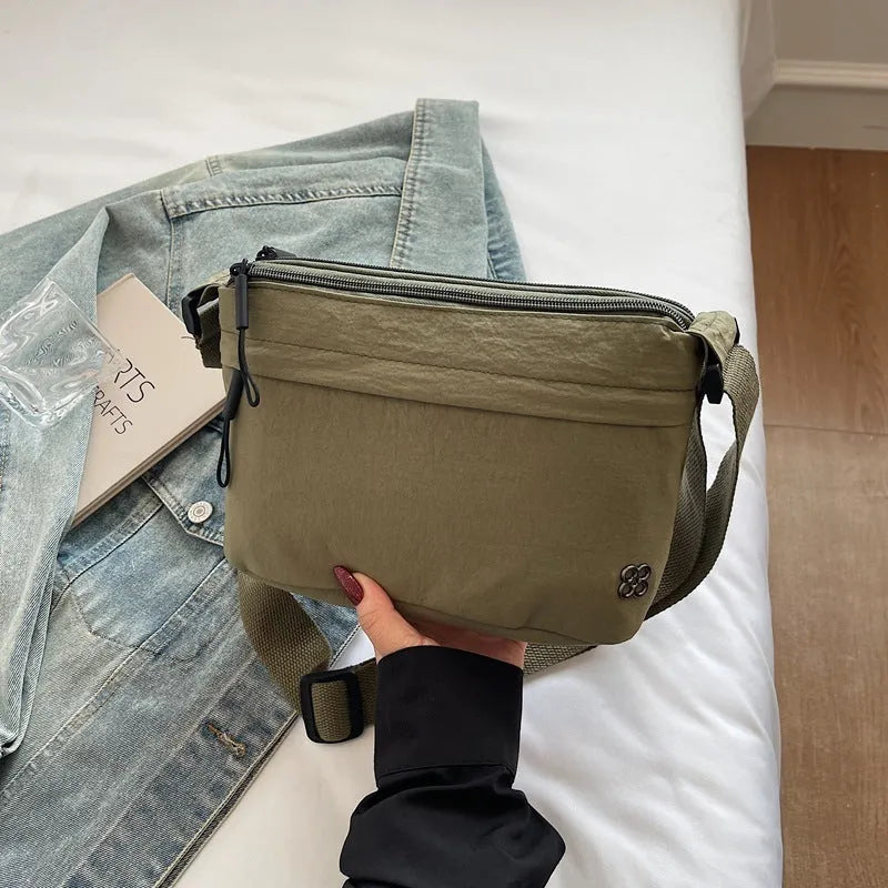 Soft cloth daily lightweight commuter crossbody bag in beige with sandwich pocket and sewn-thread detailing