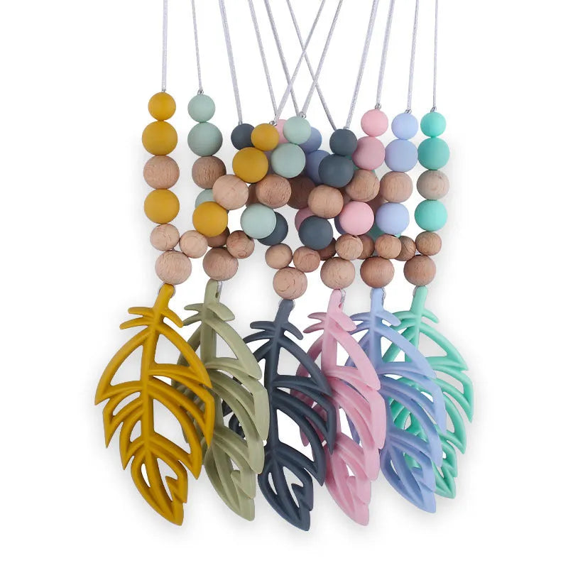 Baby silicone leaf teether necklace in mint green on a light background, BPA-free, 35g, for 3+ months