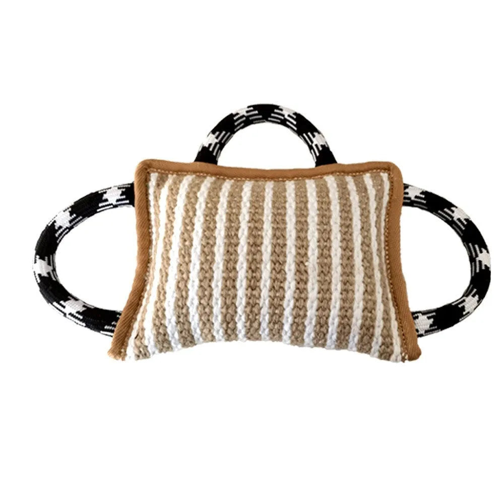 Jute dog tug toy with three rope handles and a central bite pillow for interactive play.