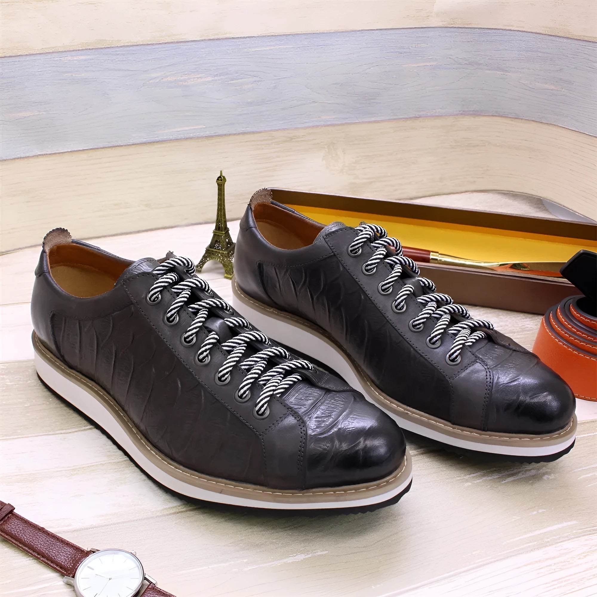 Men's white low-top casual shoes with embossed pattern texture on the front, featuring front tie laces.