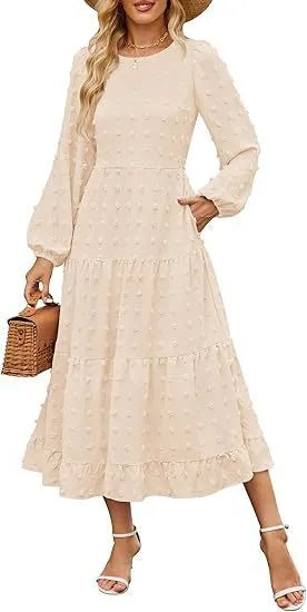 A beige high-waisted long sleeve dress with ruffled sleeves on a hanger.