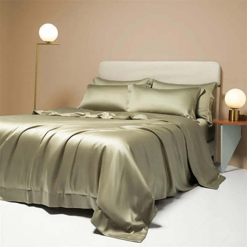 A neatly made bed with a Lenzing Tencel duvet cover and pillowcases in a soft grey colour.