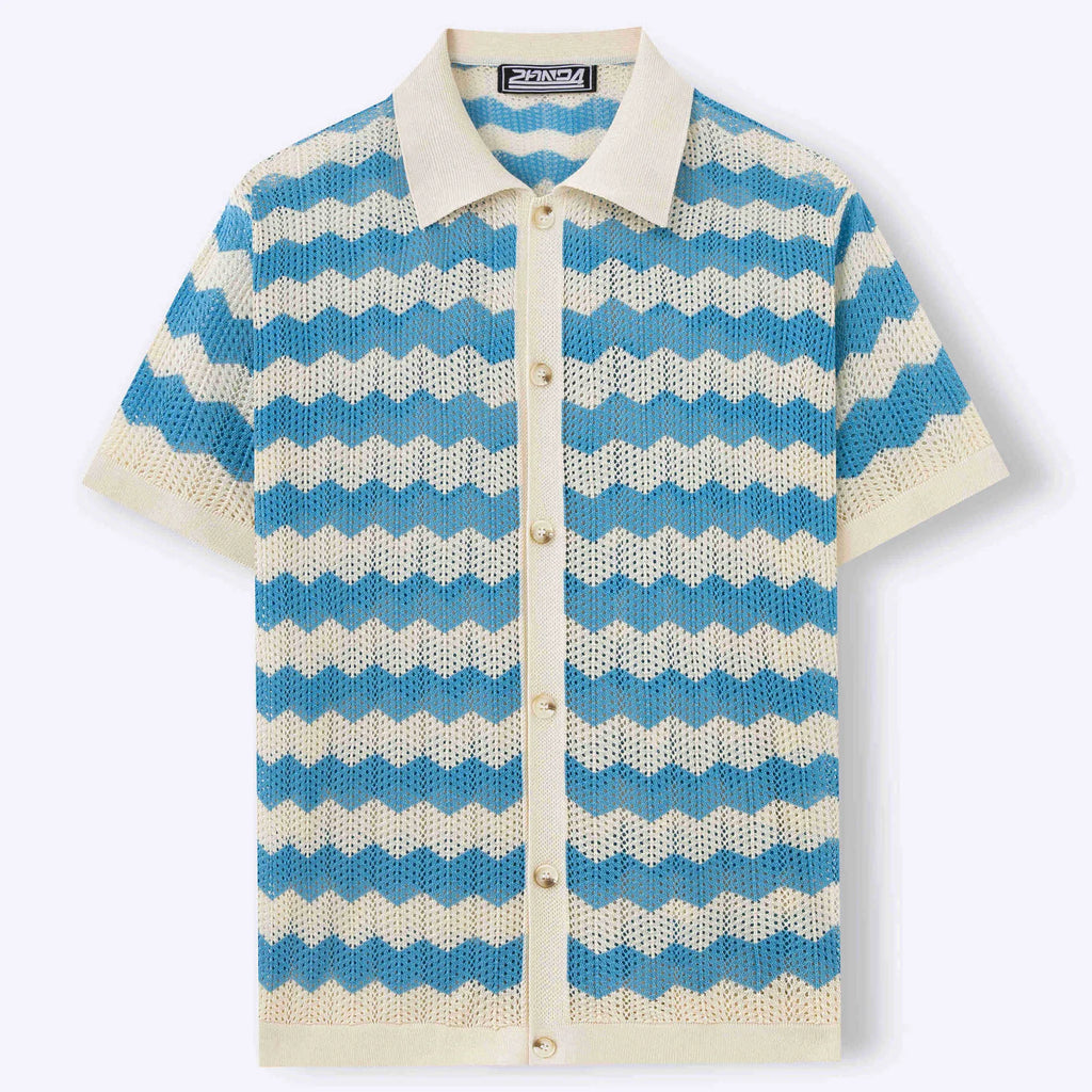 Man wearing a blue short-sleeve sweater with a textured jacquard knit pattern.