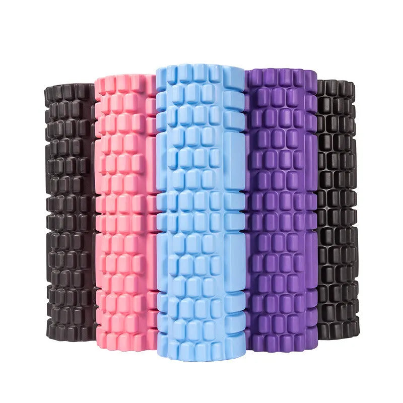 A solid EVA foam roller for fitness, shown in a selection of colours including black, pink, and blue.