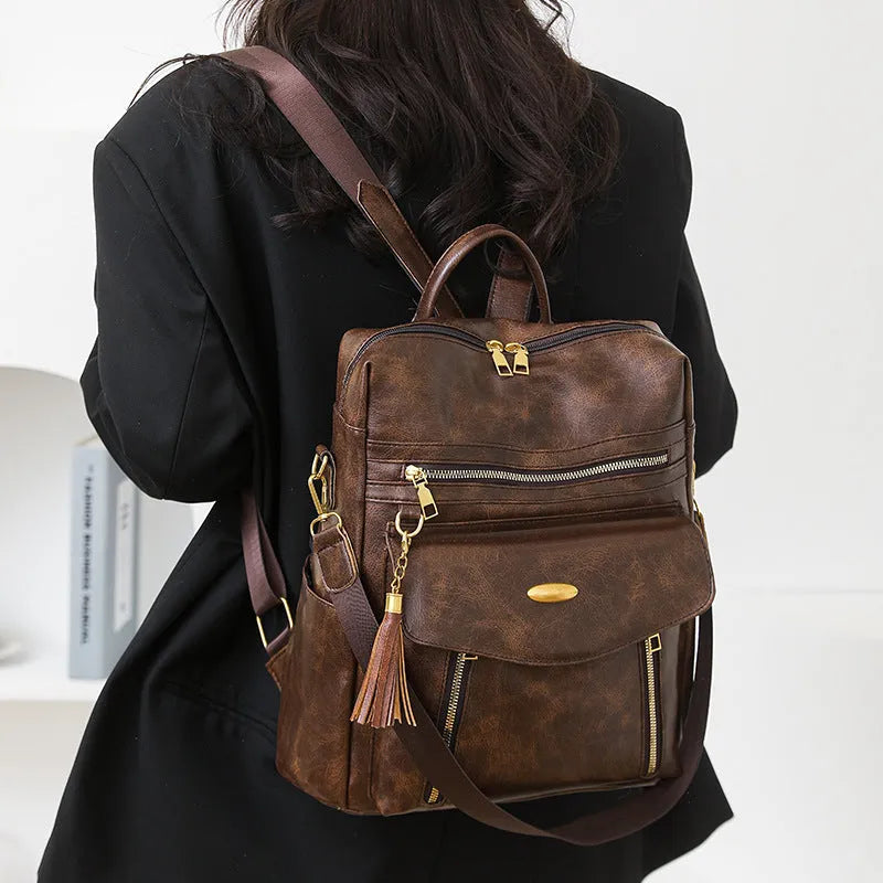 Crossbody casual ladies backpack in PU with soft construction, sewing thread details, black colour, phone pocket