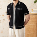 Slim black lapel collar knitted polo shirt with short sleeves on a mannequin.