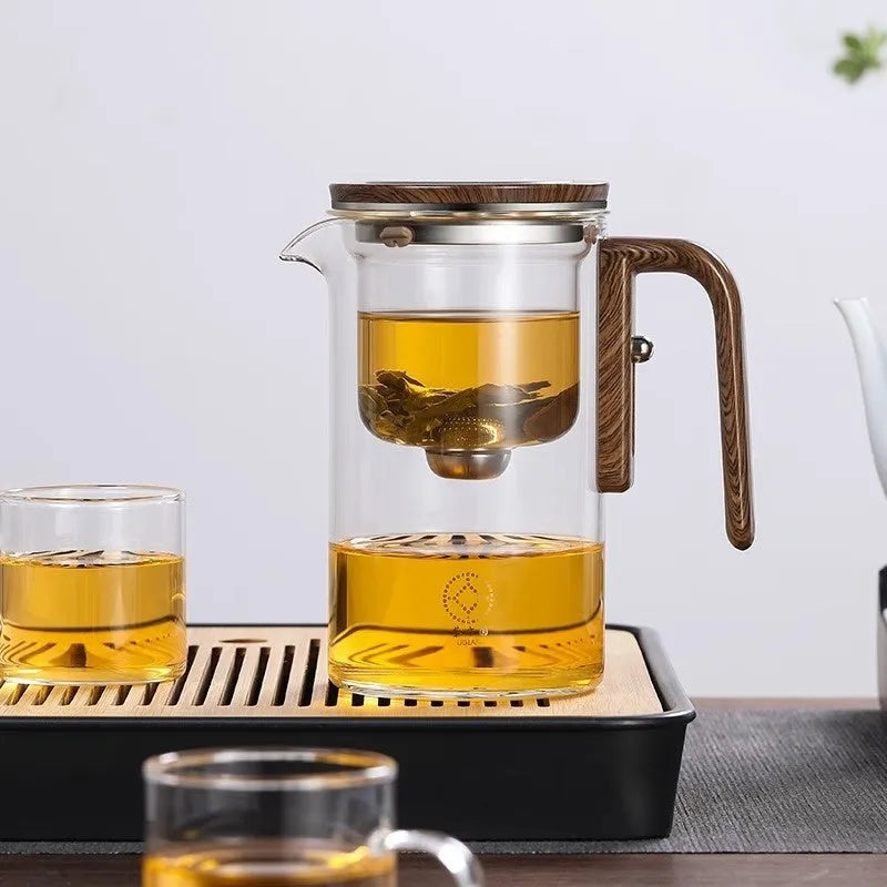 Glass teapot with magnetic separation button, walnut wood handle, and Chinese style design on tea tray