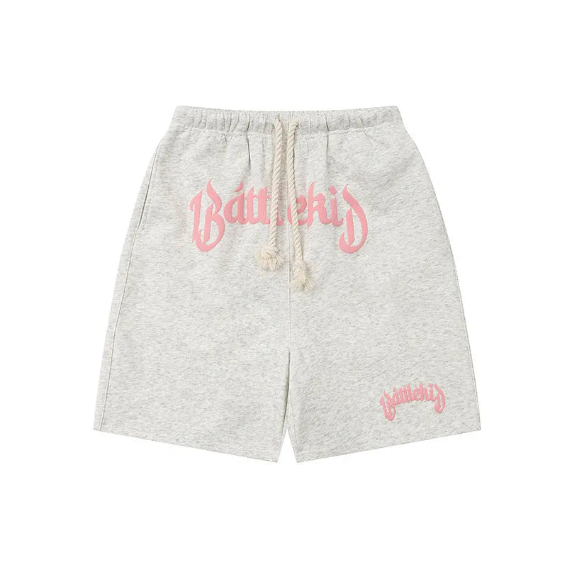 Loose grey cropped sweatpants on a neutral background