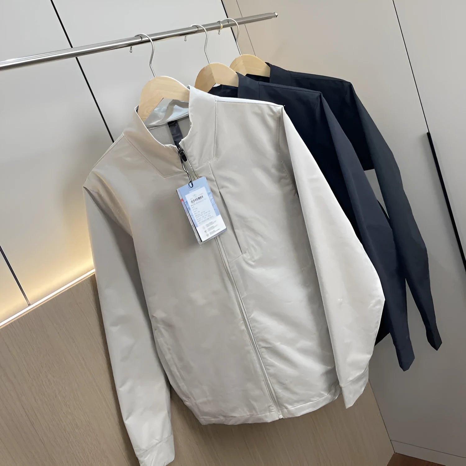 Men's stand collar polyester casual jacket in black, dark blue or milky white with straight hem