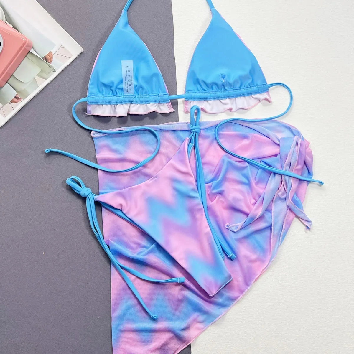 Women's split tie-dye swimsuit bikini set showing bra, skirt and panties