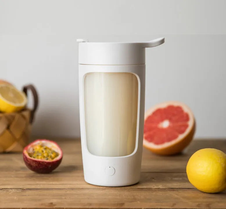 Portable rechargeable blender cup in blue, showing the 650ml capacity bottle and motorised lid.