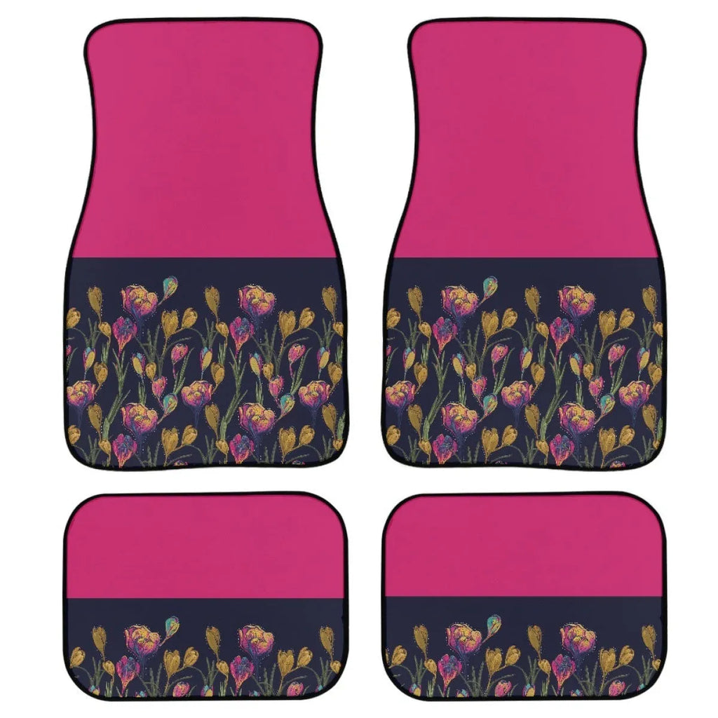 Set of four black rubber car floor mats with a textured surface, shown in a vehicle footwell.