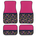 Set of four black rubber car floor mats with a textured surface, shown in a vehicle footwell.