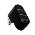 Black USB 3.0 four-port rotary hub on a desk next to a laptop, showing compact size.