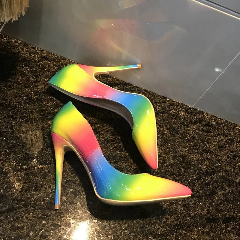 Rainbow patent leather women's high heel shoes with pointed toe and thin stiletto heel.