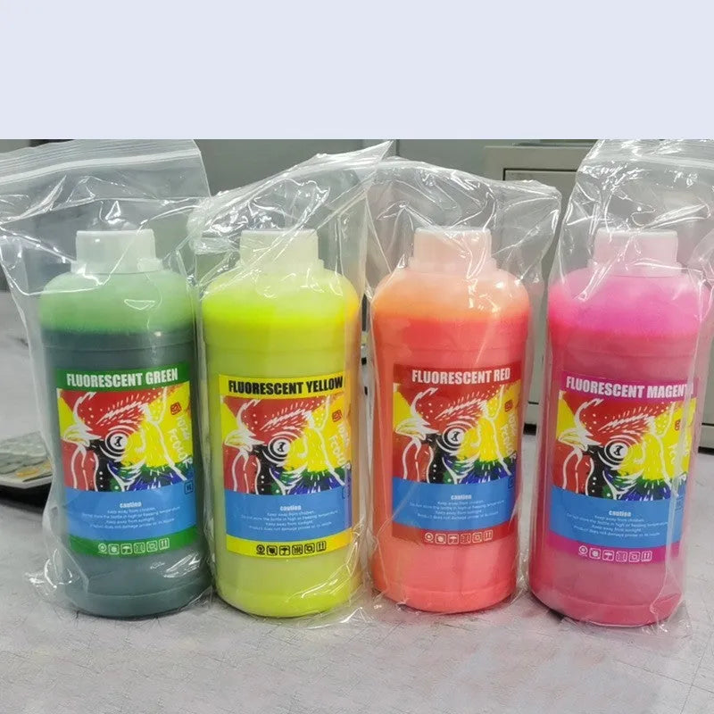 Fluorescent sublimation ink bottles in red, yellow, orange and green colours for heat transfer printing
