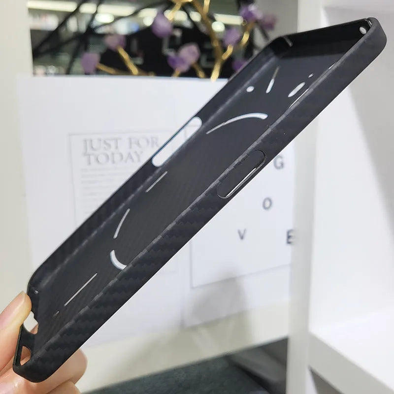 Real aramid fiber phone case in matte black hollow finish for Nothing Phone 2 with plaid texture