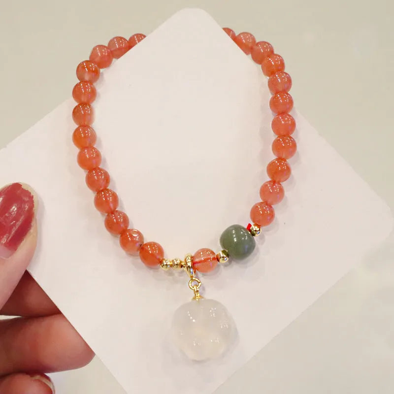 Women's bracelet with 8mm red agate cat's paw beads on a 6mm band.
