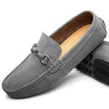 Men's black slip-on leather shoes with square toe and flat rubber sole on a neutral background.