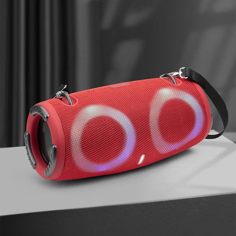 War Drum portable Bluetooth speaker with multi-colour RGB lights, showing carry strap and waterproof casing.