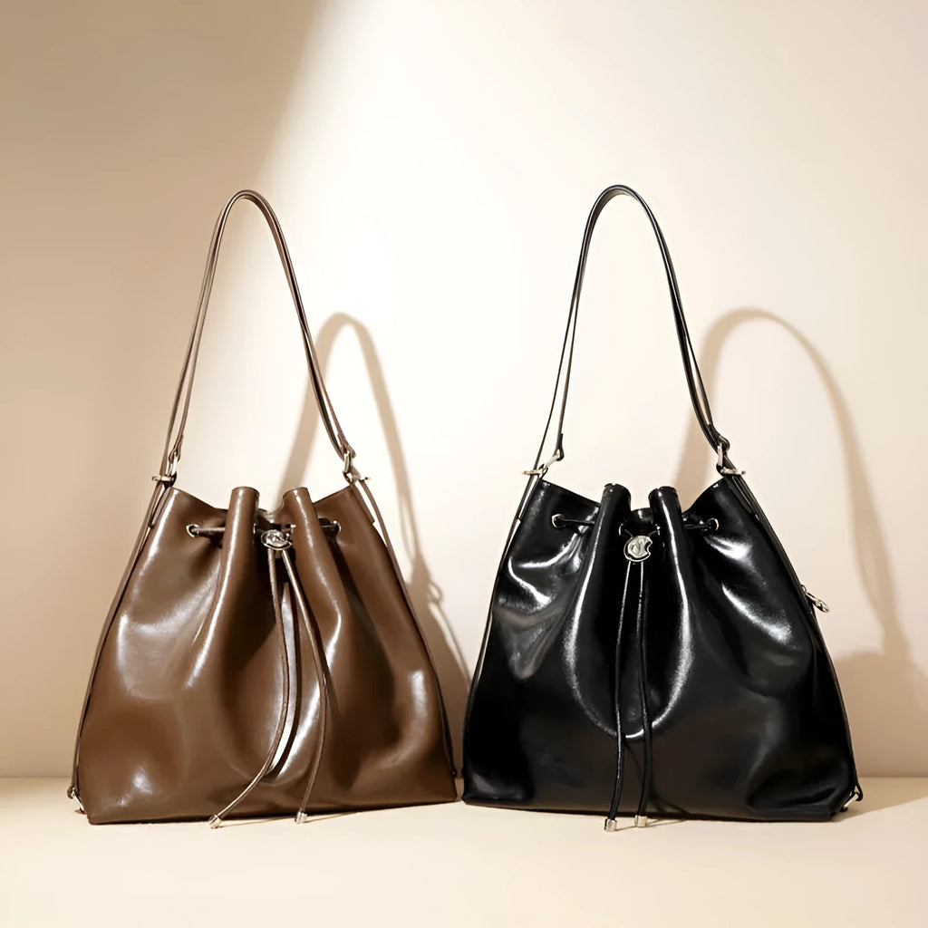 Genuine leather women's bucket bag with one shoulder strap in a retro style.