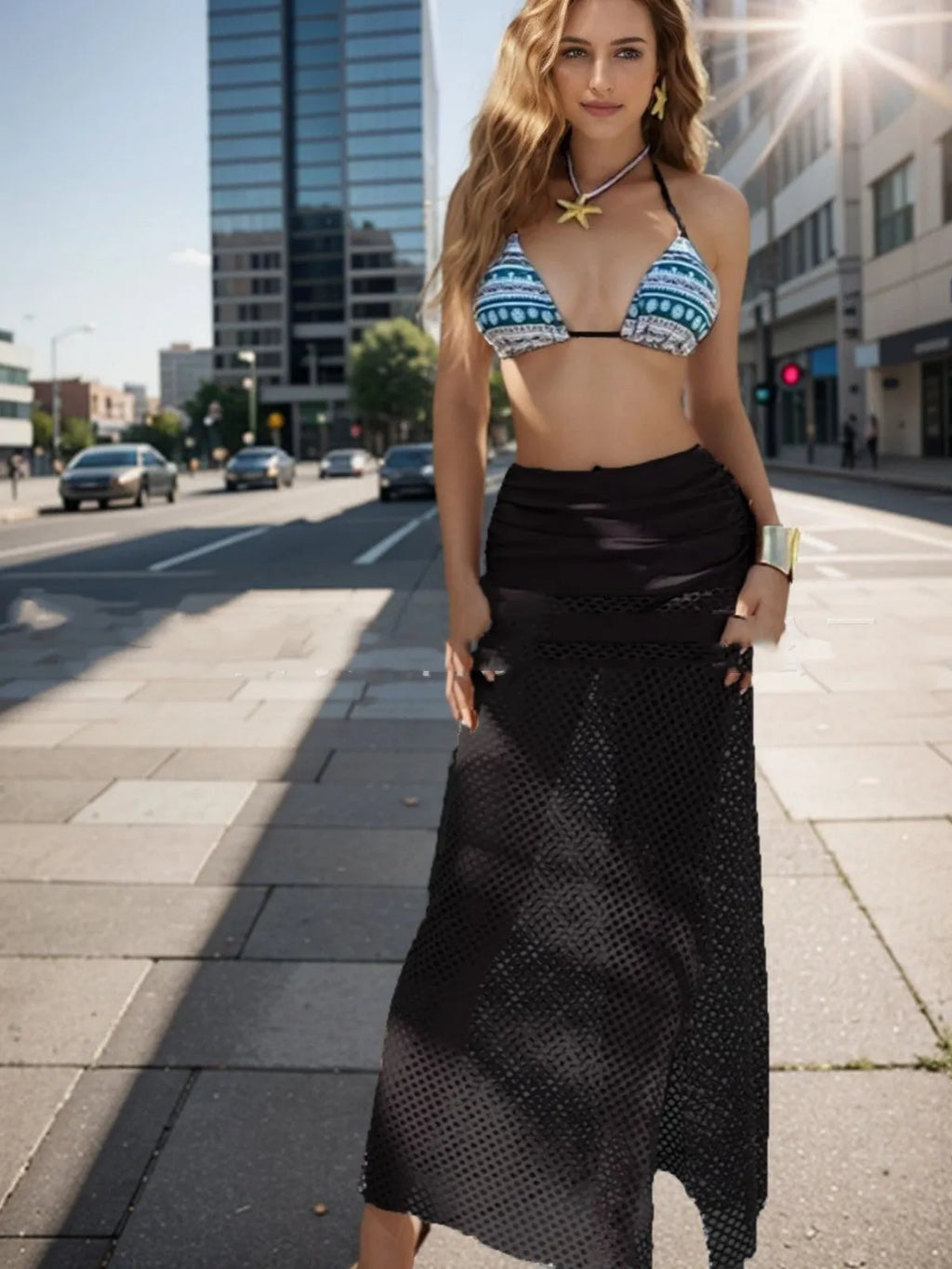 Women's brown gradient bikini set with a long fishnet skirt laid flat.