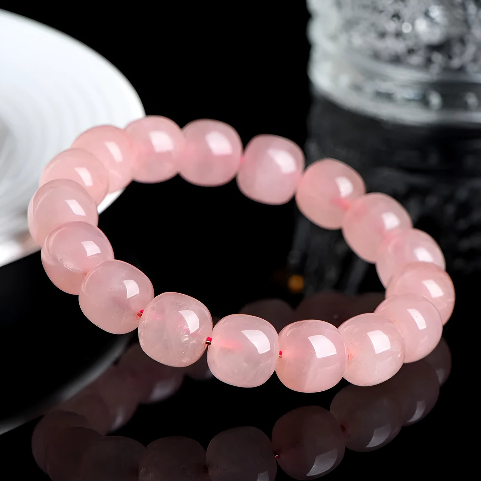 Pink crystal barrel bead bracelet with 8x10mm geometry-shaped stones on wrist