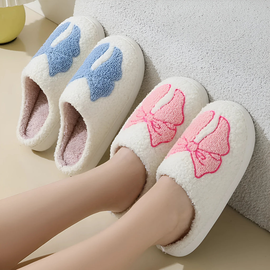 Pink and blue cartoon bow knot oversleeve slippers with suede upper and TPR sole.