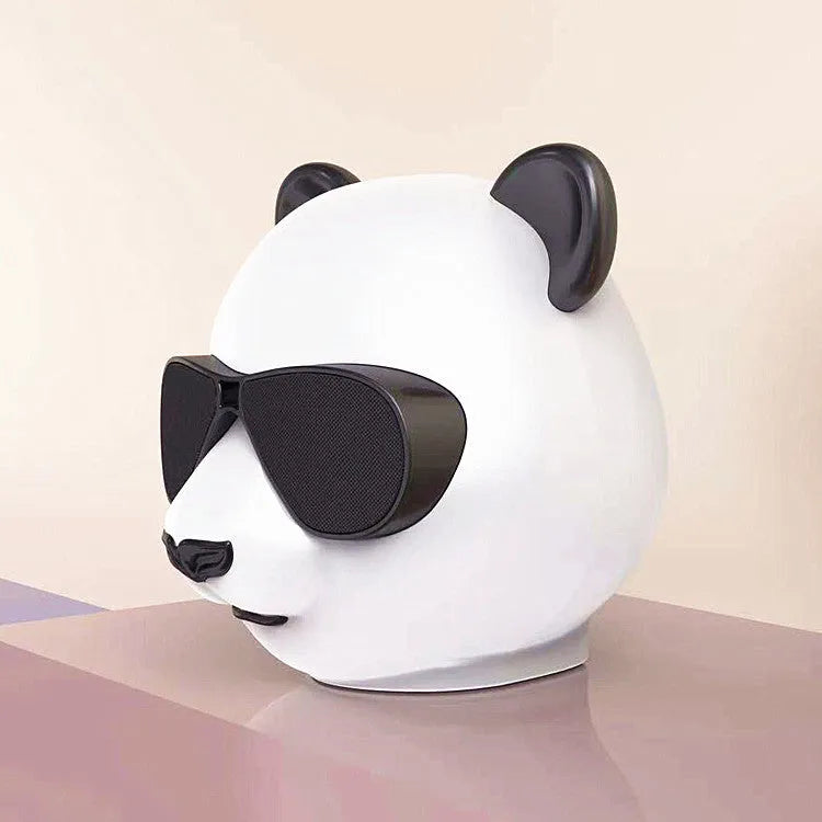 Portable mini Bluetooth speaker in a classic style design showing front grille.