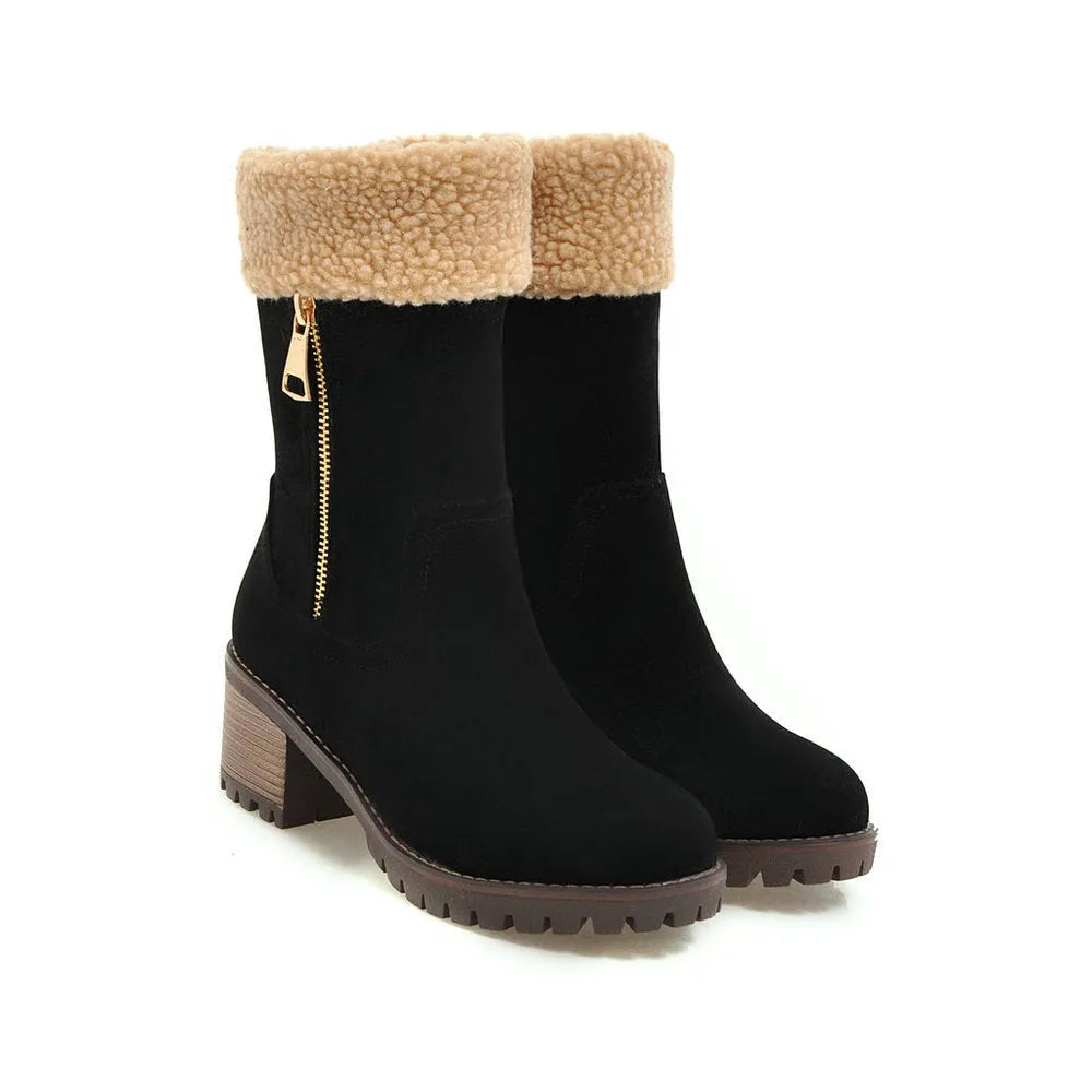 A pair of black snow boots with a plush lining and rubber insole on a winter background.