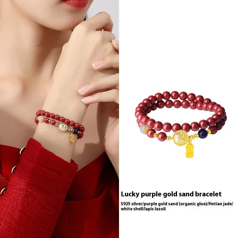 Close-up of a women's 925 sterling silver bracelet with a purple gold sandstone blessing charm and 6mm beads.