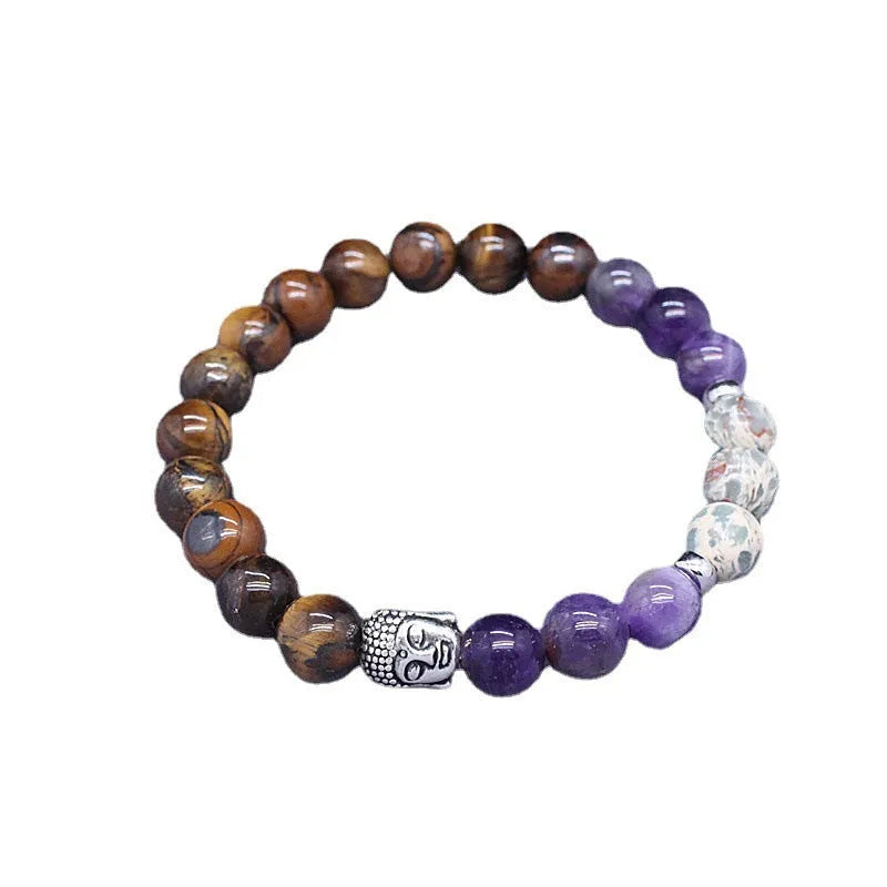 Natural stone elastic bracelet in a mixed colour pattern on a wrist.