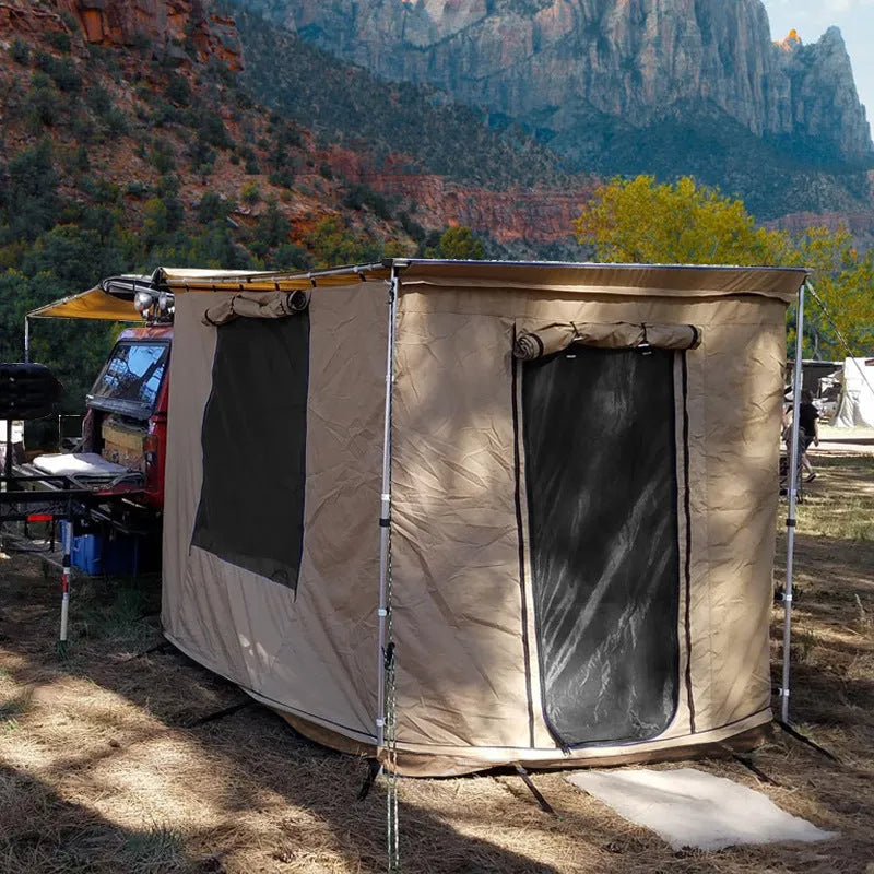 Black glue waterproof two-bedroom camping tent with aluminium poles set up outdoors.