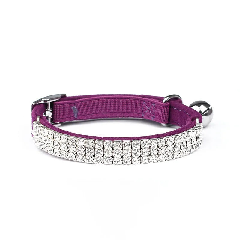 Adjustable red velvet cat collar with a silver rhinestone detail on the buckle.