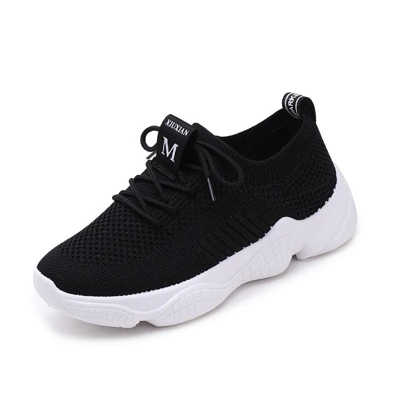Women's white thick-soled sports shoes with flying woven upper and front strap.