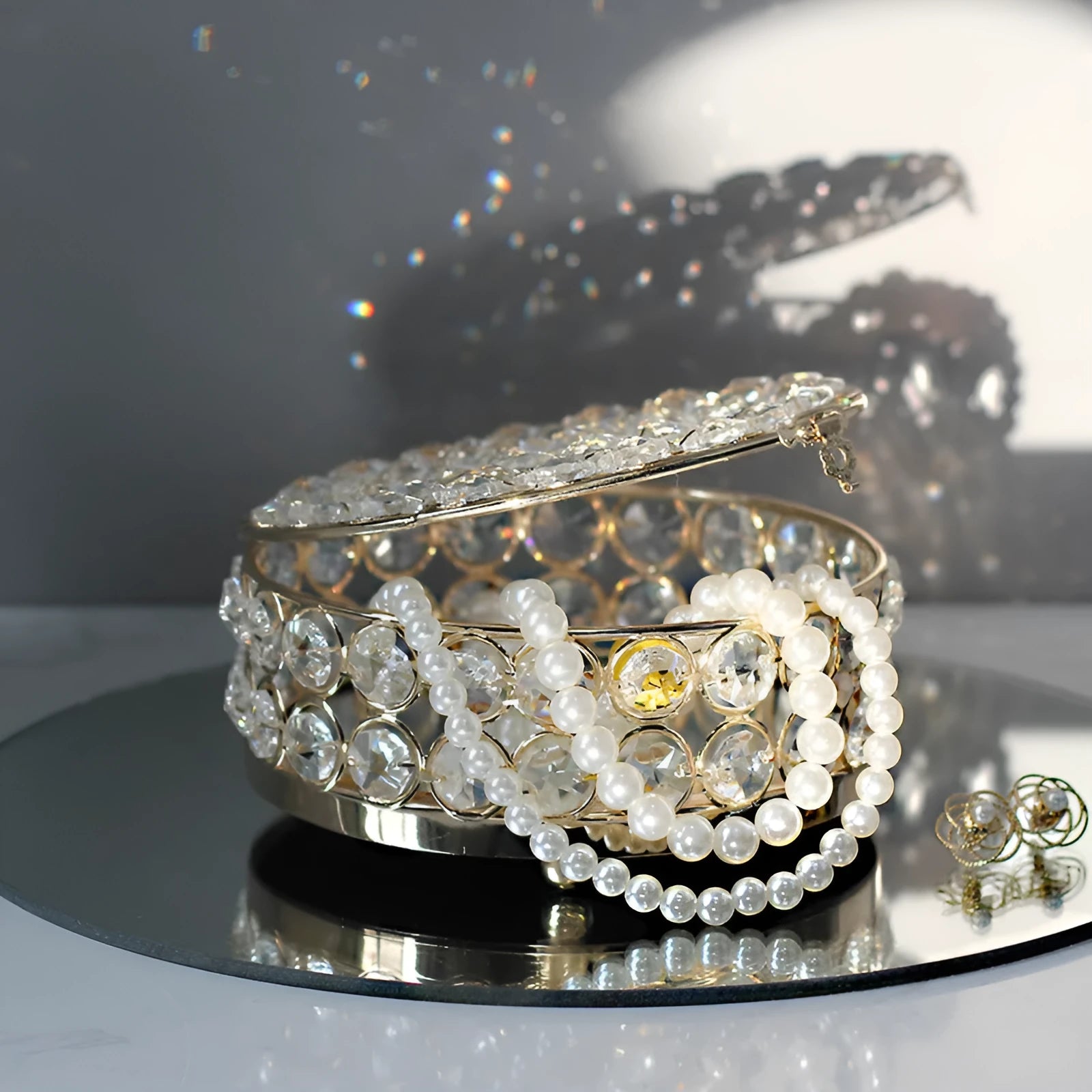 Clear crystal glass jewellery storage box with a French gold-coloured metal frame.