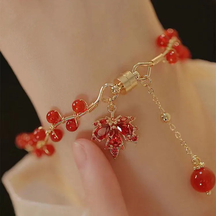 Red ginkgo leaf charm on an alloy magnetic bracelet with Chinese style design.
