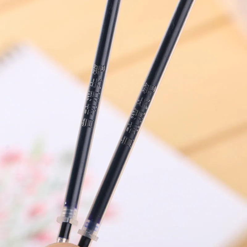 Automatic fade and disappear pen set with clear plastic holder and eight refill cartridges.