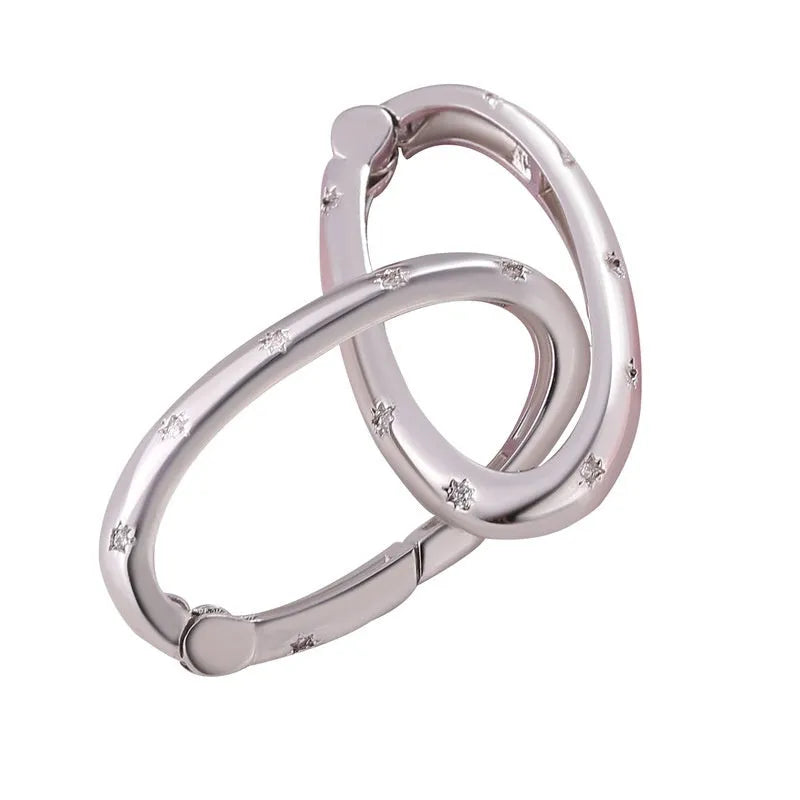 Copper climbing heart button fastener with micro-inlaid zircon stones and gold electroplating.