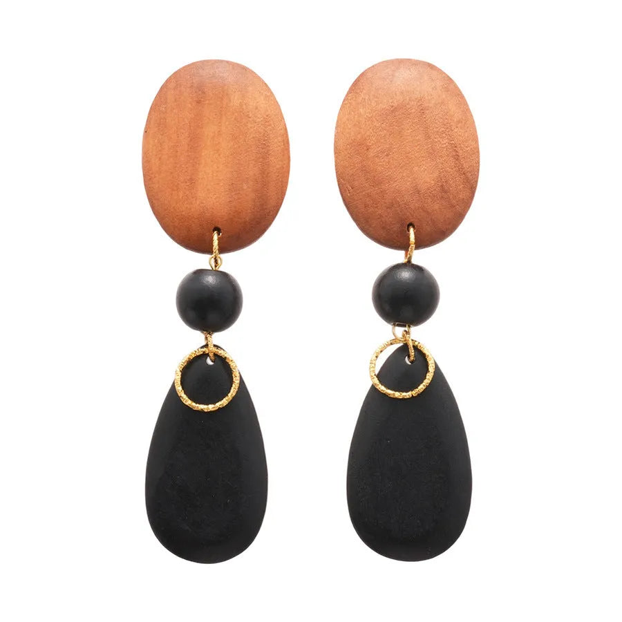 Wooden drop earrings with oval ellipse shape and silver needle accents in brown black colour