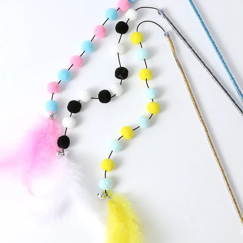 Cat toy teaser stick with plush ball and feathers, approximately 31 cm long, on a plain background.
