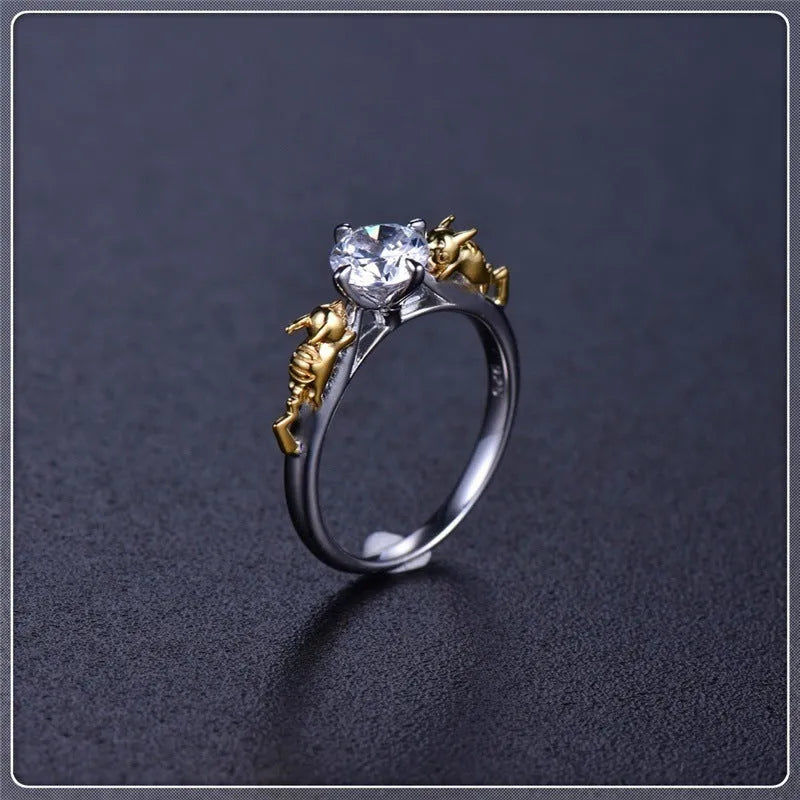 A black gold finished crown motif ring on a copper base, shown on a finger, with detailed modelling visible.