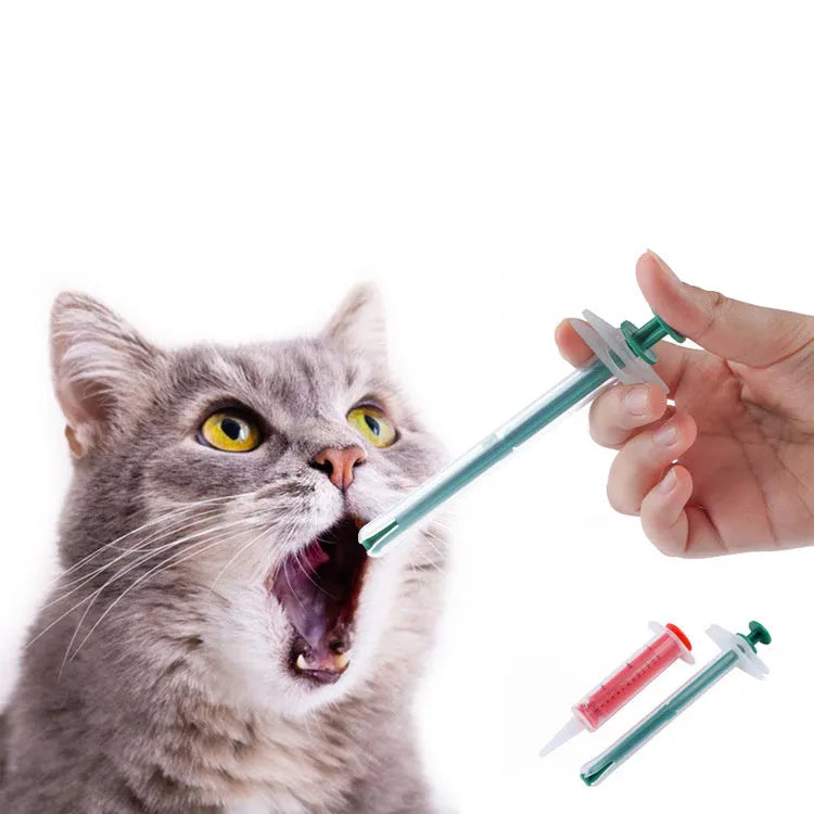 Two pet pill shooters with soft silicone tips, measuring 15cm and 11.5cm, for administering medication to cats and dogs