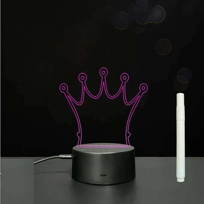 3D acrylic LED message board with touch control, black ABS base, USB cable, and stylus pen on desk