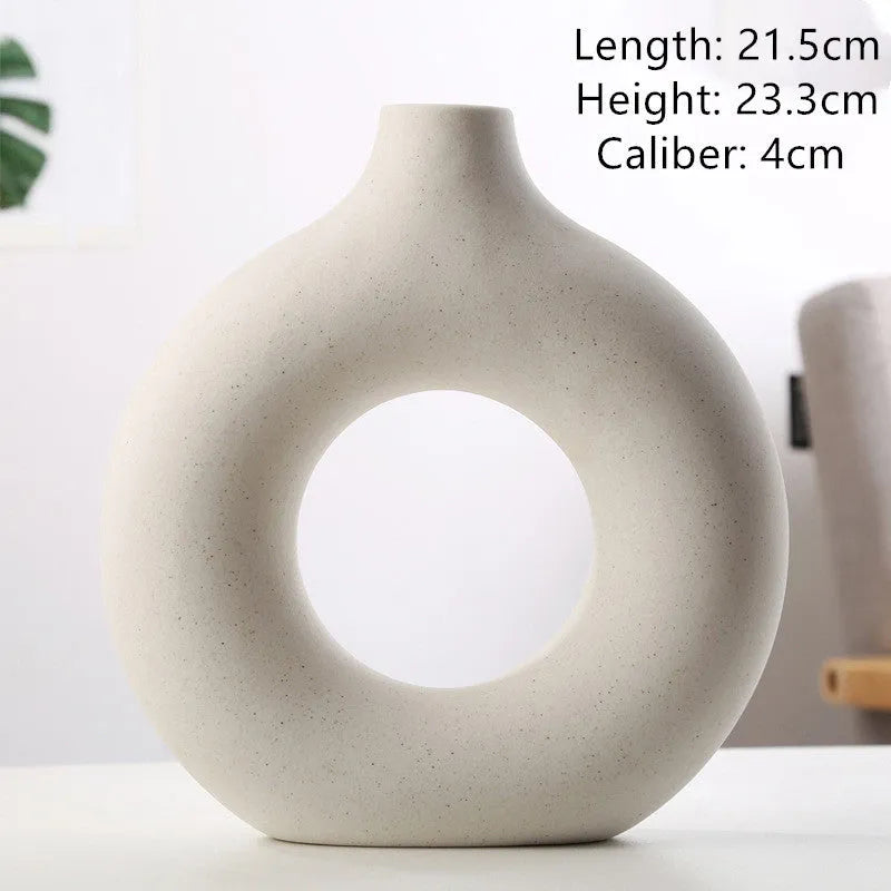 A simple modern frosted porcelain biscuit vase for flower arranging, shown in a neutral colour.