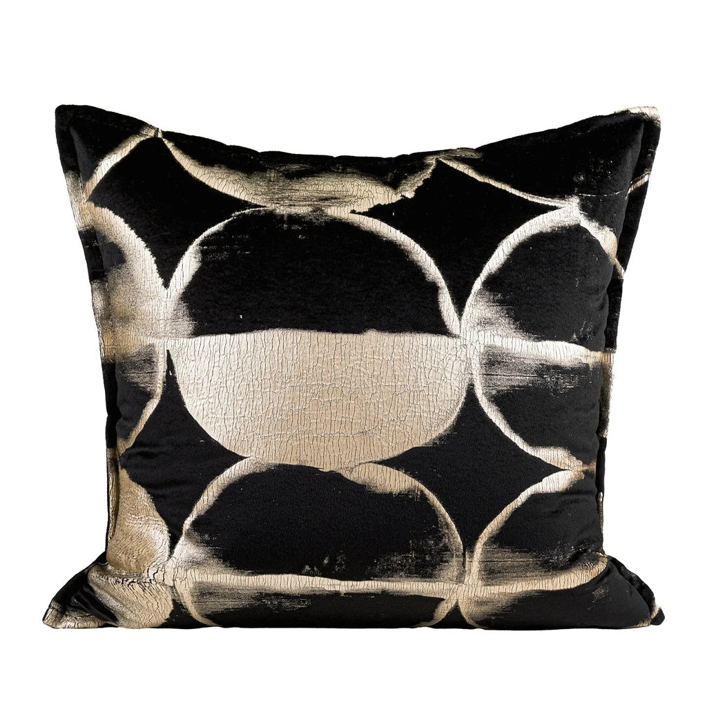 Black and gold abstract pattern flannel pillow cushion on a sofa, shown with removable cover.