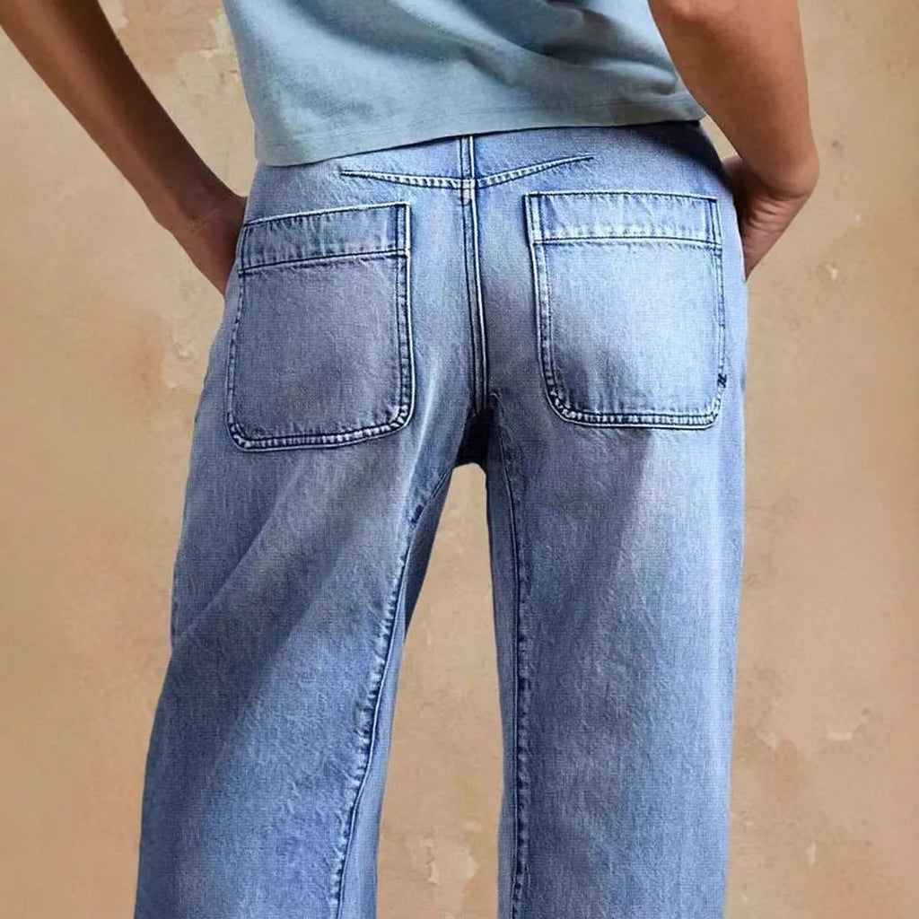 Casual loose jeans trousers in light blue denim with washed finish