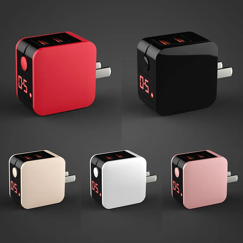 Black 5V2A dual USB wall charger with digital display screen, showing charging percentage, next to a UK 3-pin plug.